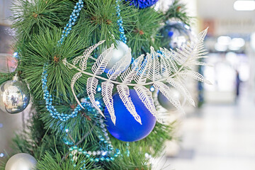 close-up decorative New Year's decoration with artificial flowers and balls.Preparing for Christmas