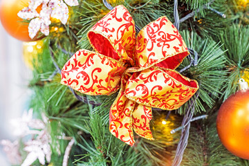 Christmas decoration with ribbons and other decorations on the Christmas tree. Christmas