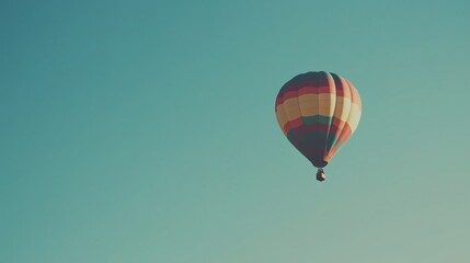 Obraz premium Colorful hot air balloon floating in clear blue sky