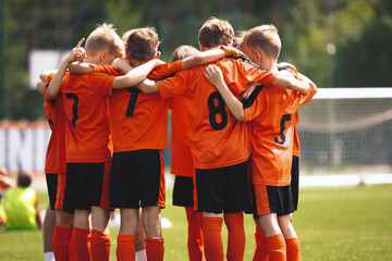 Kids Play Sport. Sports Team Huddle. Children Sports Team United Ready to Play Game. Kids Sports Team in Red Shirts. Youth Sports For Children. Boys in Sports Uniforms. Young Boys in Soccer Sportswear