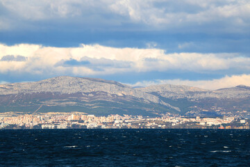 Contemporary buildings, gardens and beaches at the waterfront in Split, Croatia. View of Split from the boat.