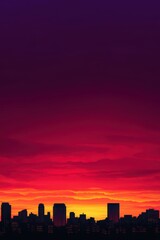 Fototapeta premium A vibrant sunset casts a stunning gradient over a city skyline silhouetted against the colorful sky.