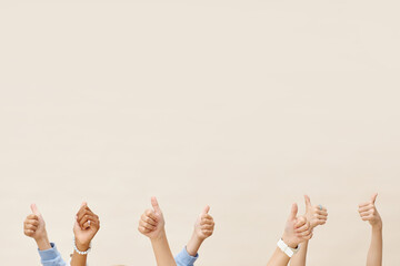 Hands of Kids Raising Thumbs up Showing Approval on Neutral Background in Studio