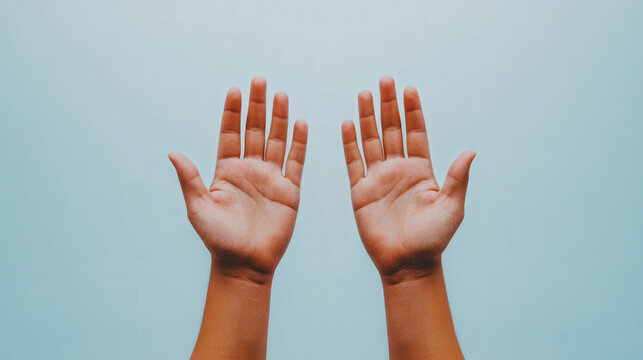 A pair of hands reaching out through a sky