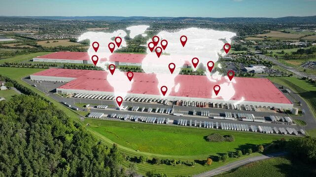 Large american warehouse with parking trucks in rural area. Digital Animation of world map over industrial company in USA at sunny day. Aerial wide shot. Modern Logistics Delivery theme with hologram.