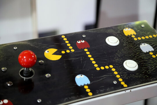 Close-up of joystick of classic Pacman arcade video game. Video game from the 80s. Pac man. Pac-man.