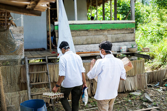 Portrait of People Distributing Aid Packages