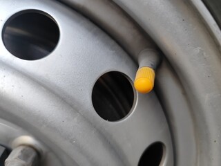 Close-up of a car air pump, focusing specifically on air filling.