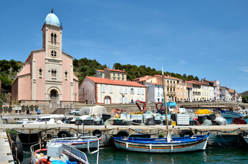 Fototapeta premium Fisching port and church Notre-Dame de Bonne Nouvelle viewed of front at Port-Vendres, commune on the 