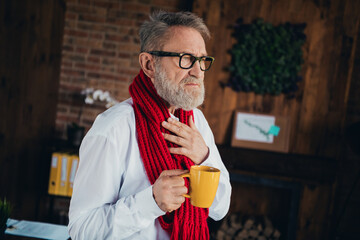 Fototapeta premium Photo of nice old man sore throat drink tea wear white shirt formalwear coworking successful nice light office