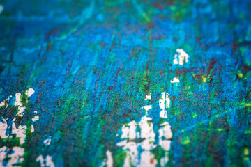 Extreme close up of colorful acrylic paint texture showing brush strokes. Selective focus.