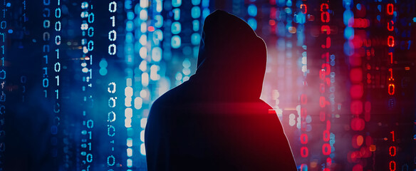 A silhouette of a hooded criminal hacking a computer against a binary code background, rendered in 4K, representing a cybercrime concept.