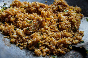 Close-up of flavorful fried rice. A perfect dish. A Culinary Delight of Delicious Fried Rice in a Wok.