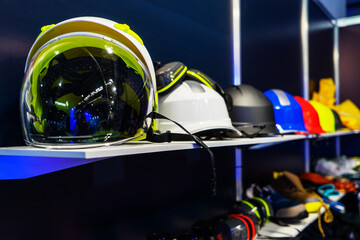 Fototapeta premium Multi-colored protective helmets for engineers, builders, workers of the oil and gas industry, for handymen in the shop window, at exhibitions. Compliance with safety regulations