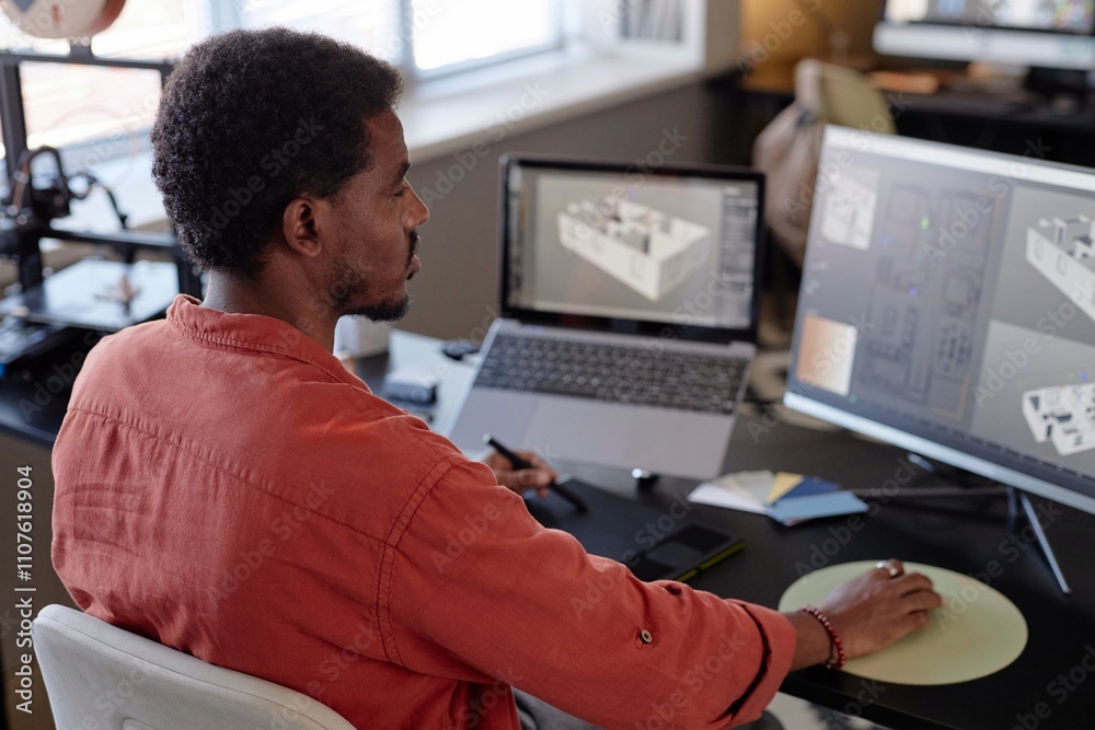 Fototapete african american man focusing on creating architectural designs on large screen in modern office set