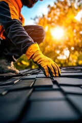 A worker in gloves carefully lays roof tiles under a warm sun, showcasing craftsmanship and dedication in roofing. The vibrant backdrop highlights the beauty of outdoor work.