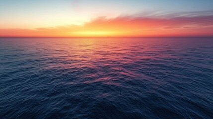 Obraz premium Serene Sunset Over Calm Ocean Waters with Vibrant Colors