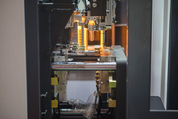 The drinking water bottle manufacturing process by blow mold machine.