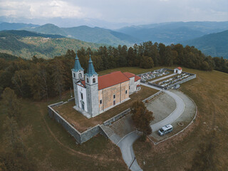 Aerial view of Marijino Celje church near Gorenja vas, Soca valley, Slovenia