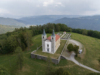 Aerial view of Marijino Celje church near Gorenja vas, Soca valley, Slovenia