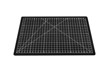 A black cutting mat with a white grid is isolated on transparent background.