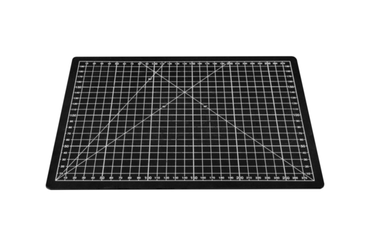 A black cutting mat with a white grid is isolated on transparent background.
