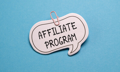 Concept of Affiliate Program write on sticky notes isolated on Blue Table.
