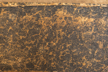 Old, antique, brown, weathered, faded, worn book cover. Copyspace.