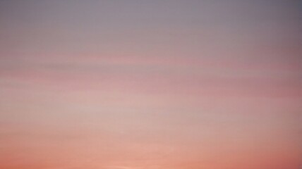 Fototapeta premium Beautiful sunset hues paint the sky over a quiet landscape during evening hours in peaceful serenity, background abstract wallpaper 