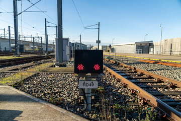 Red warning signal light flashing at railway depot