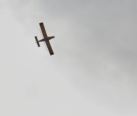Aerial tractor crop dusting on adjacent farm land in mid November!