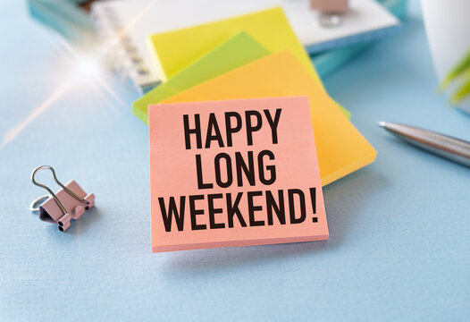 Happy Long Weekend text on notepad, concept blue background