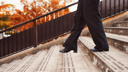 Walking, steps and travel with business person in Japan city for commute, journey and professional. Corporate, urban and pride with closeup of shoes of employee and stairs for confidence and legs