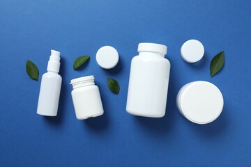 White bottles on color background 