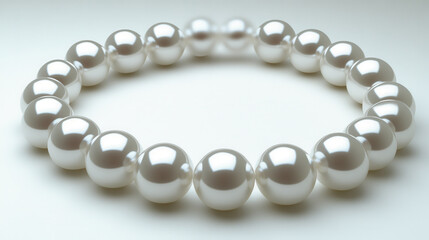 Obraz premium Elegant pearl necklace on light background, showcasing its lustrous shine and smooth texture, perfect for adding sophistication to any outfit