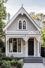 Obraz premium Elegant Victorian Style House with Intricate Details and Modern Touch, Surrounded by Lush Greenery in a Picturesque Neighborhood