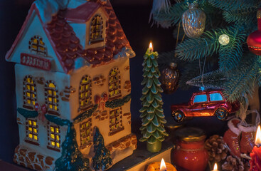 Fototapeta premium Winter holiday concept. Inspiration and fairy time with a candles, Christmas tree at holydays. Magical time