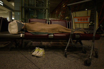 woman waiting in airport sleeping