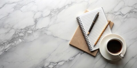 A Minimalist Workspace with a Cup of Coffee, Notepad, and Writing Utensils on a Marble Surface