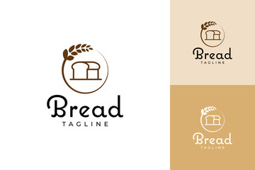 Fototapeta premium bakery logo with a bread loaf on top of wheat leaves