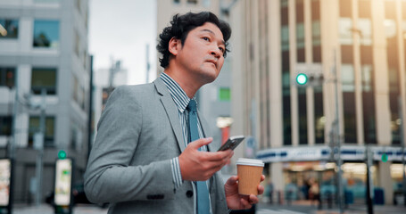 Asian, businessman and waiting with phone for transport, taxi or cab in city for business trip or commute. Japan, man or traveler looking for ride on travel app or mobile smartphone in an urban town