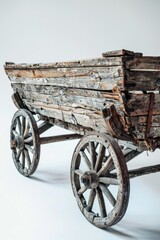 Obraz premium A vintage wooden wagon sits atop a clean white floor, perfect for rustic or country-themed settings