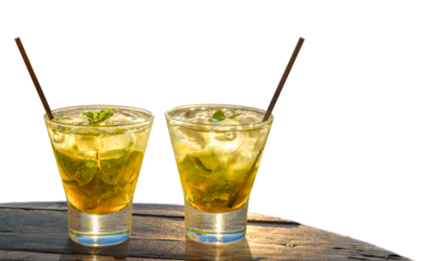 two mojitos on a wooden table, isolated withe background