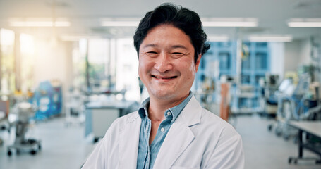 Fototapeta premium Portrait, man and doctor in hospital, smile and confidence with career ambition. Japanese person, medical and healthcare professional in clinic, pride and surgeon with cardiology and wellness center