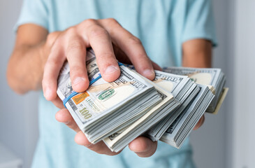 Man of hundred dollar bills close up. Stock market financial illegal freedom exchange earn pile...