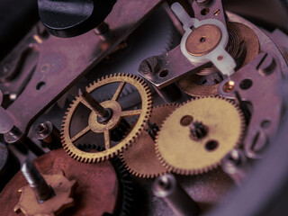 Close-up of a mechanical mechanism with gears, symbolizing watch repair and complex micromechanics