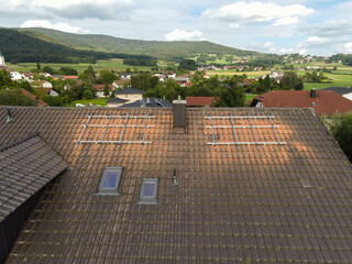 Drone View of Residential Roof with Aluminum Structures Prepared for Solar Panel Installation