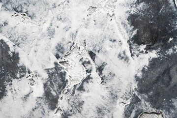 Abstract black and white texture resembling icy surface with natural patterns