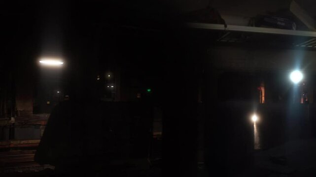 Dimly lit grungy underground trainyard New York City Grand Central Station