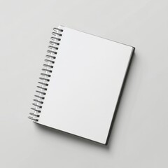 Blank spiral notebook on gray background for writing notes and ideas